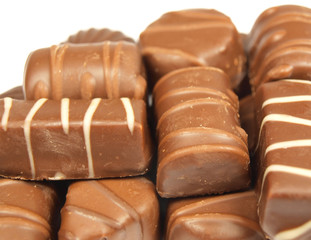 Chocolate sweets isolated on white abstract background