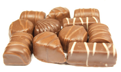 Chocolate sweets isolated on white abstract background