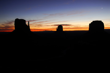 Silhouette of the "Mittens" in Monument Valley at dawn