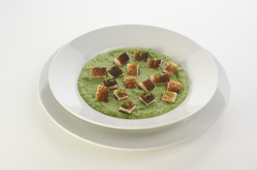 organic home made pea puree on a white plate