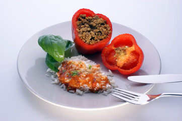 red mince filled paprika with basil leaf and rice