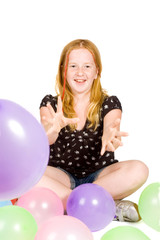 Fototapeta na wymiar young girl playing with balloons