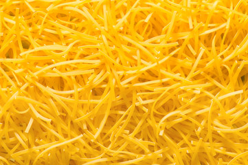 Extreme close up of yellow italian pasta