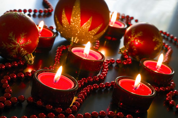 Red candles, beads decorated with reflective surfaces.