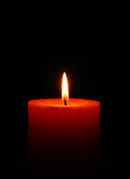 Close up of a candle with black background