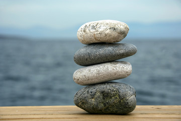 background image of the beach with Pile of pebble Stones