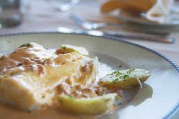 Fish and potatoes meal on a plate