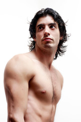 Latin young man without a vest on a light background.