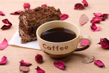 Biscuit cake with cup of coffee
