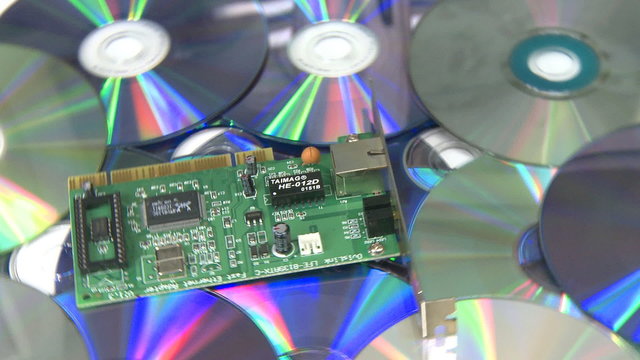 Computer circuit board rotating over CD