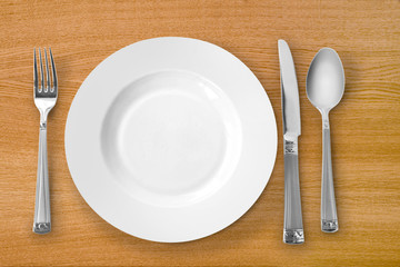 plate with fork, knife and spoon