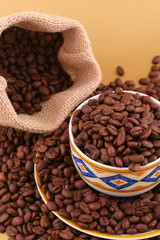 Coffee cup, beans and canvas bag