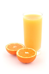 Orange juice and ripe oranges