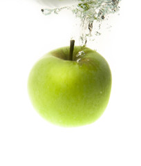 Green apple in water