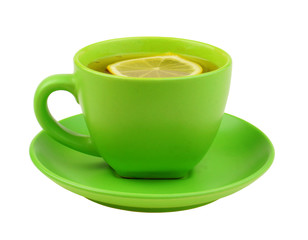 Green cup of tea with lemon