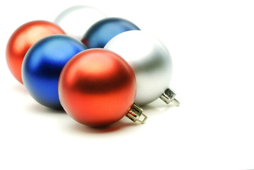 Multi colored christmas balls on white background.