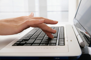 Hand and laptop