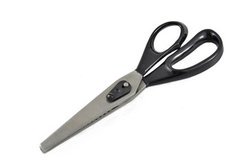 Metal scissors zigzag isolated on white background