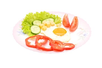 Eggs with vegetables and chunks of cheese isolated on white