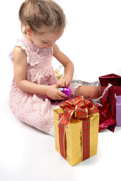 Little Girl Opening Christmas Presents