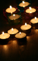 Fototapeta na wymiar candles in the darkness