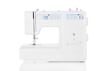 Modern electric sewing machine isolated on white background