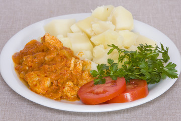 Boiled potatoes with gravy