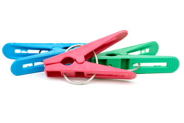 Three cheap plastic clotespins