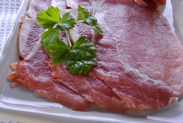 smoked bacon on a plate with organic parsley