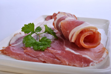 smoked bacon on a plate with organic parsley