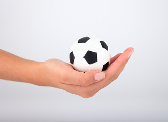 Fototapeta premium Hand with soccer ball