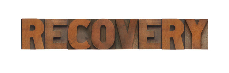 the word recovery in old wood type