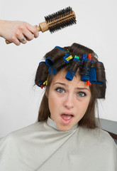 woman with hair rollers