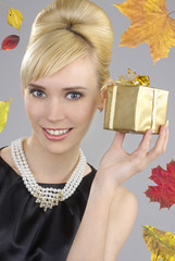 Beautiful woman holding gift