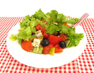 Greek salad with olives, cheese and fresh vegetables