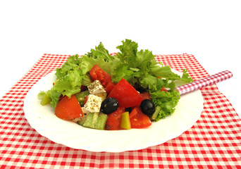 Greek salad with olives, cheese and fresh vegetables