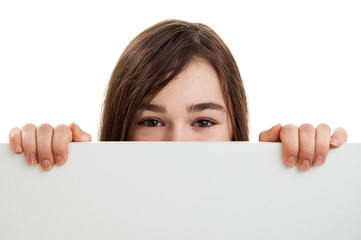 Girl behind empty board isolated on white background