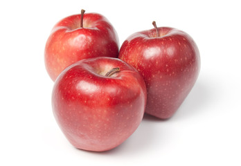 Three red juicy apples, isolated on white