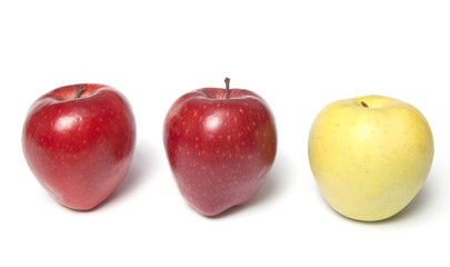 Be different - three red and yellow apples