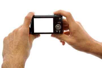 Photo camera in hands isolated on white background