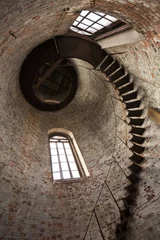 Fotobehang Spiral Staircase Inside Of A Water Tower © Anton Balazh