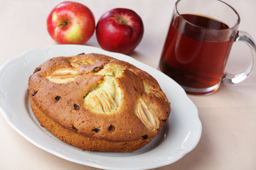 Apple pie with tea and apples