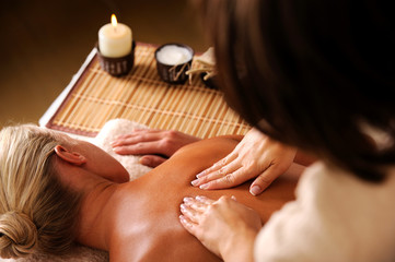 massaging  backbone of woman