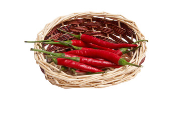 Fototapeta na wymiar Splendid, wooden basket full of red peppers