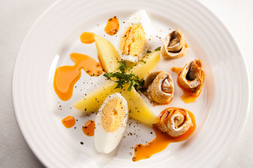 Marinated herring fillets, eggs and potatoes