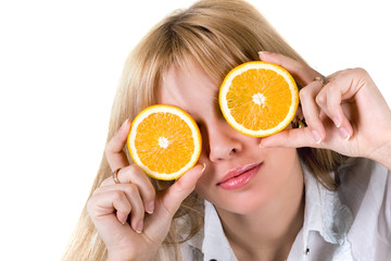 Portrait of the funny girl with oranges. Isolated on white