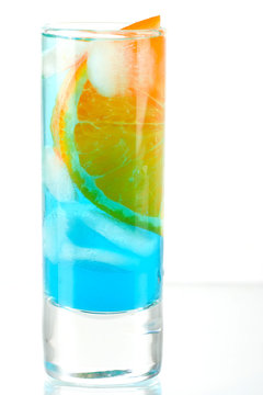 Alcohol cocktail with blue curacao and orange