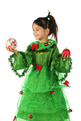 Little smiling girl in green Christmas tree costume