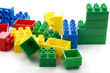vibrant collection of plastic building blocks in white background