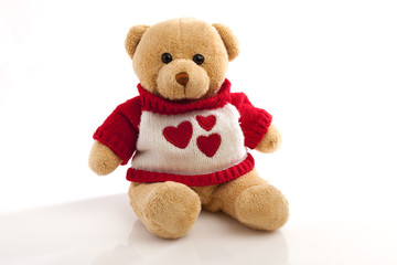 teddy-bear in the sweater with hearts